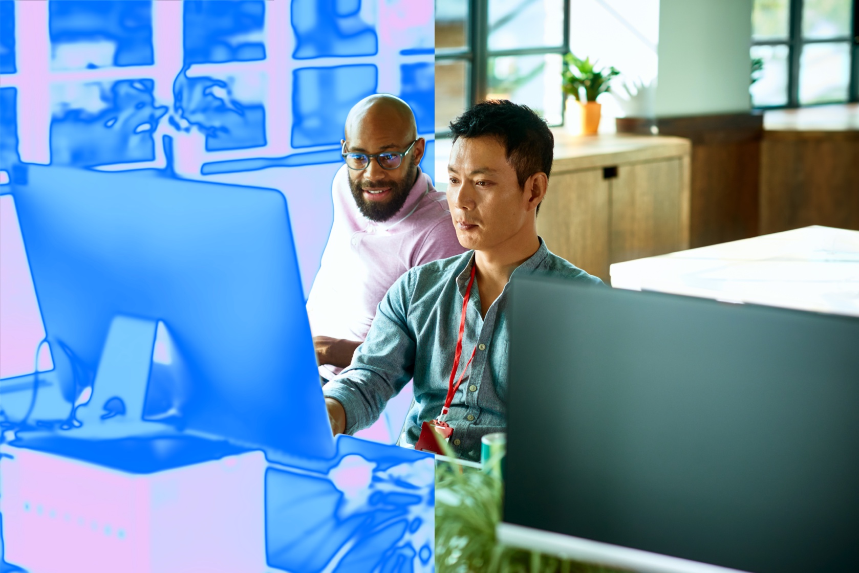 Two men working on a computer